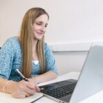 Modern legal workspace showing a lawyer working from home alongside office based colleagues, representing hybrid working in the legal sector